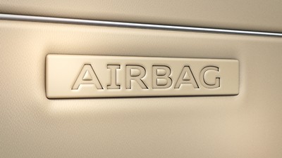 Rear side airbags with illuminated seatbelt buckles