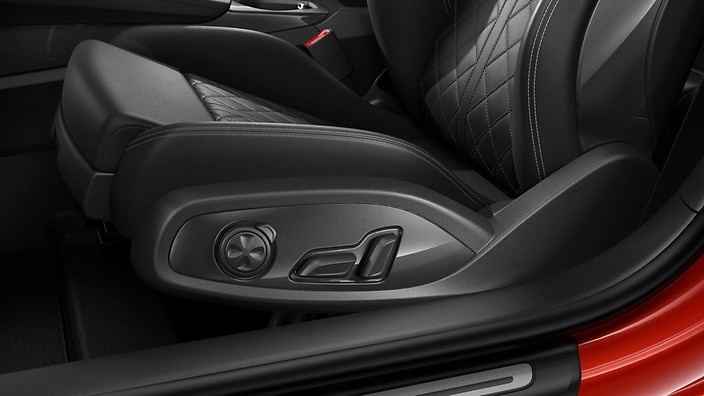 Electrically adjustable front seats with pneumatic side bolsters