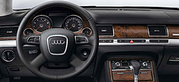 Multi-function four-arm leather steering wheel in dashboard color, heated, with MMI controls, shift paddles and leather shift knob