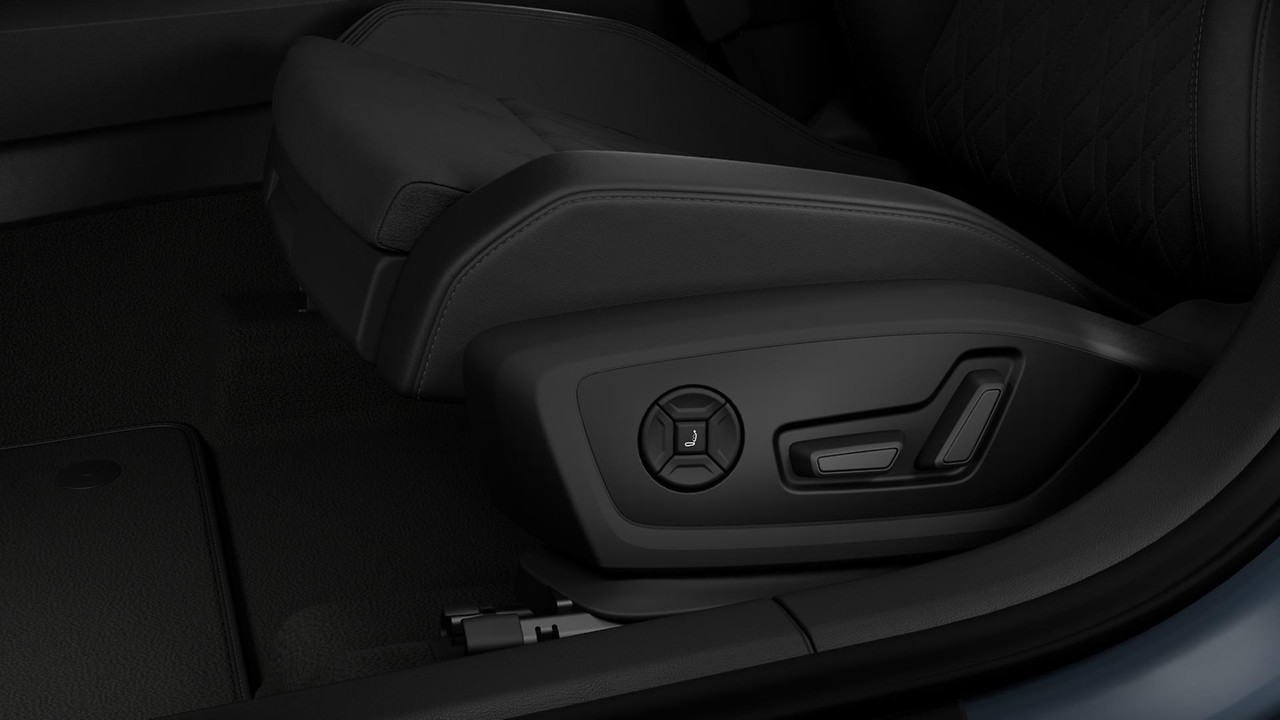 Pneumatically adjustable lumbar support with massage feature for the front seats