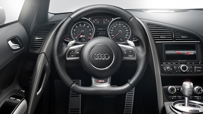 Perforated leather wrapped multi-function sport steering wheel