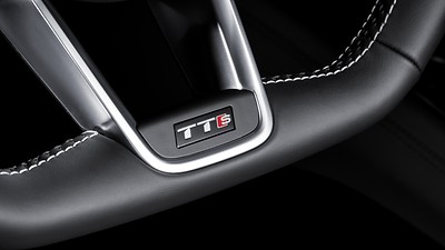 Three-spoke, multifunction, flat-bottom steering wheel with shift paddles and S badging