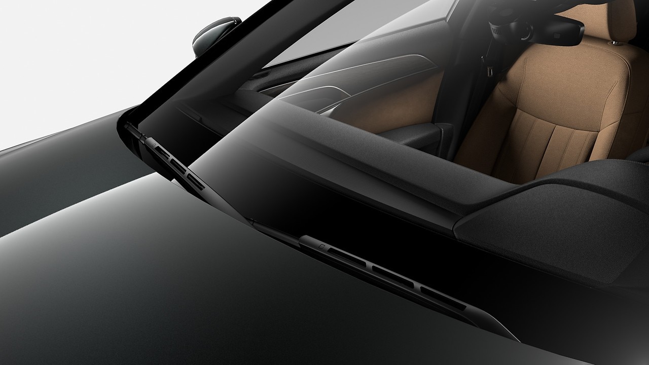 Limpador adaptativo do para-brisa com bicos ejetores integrados