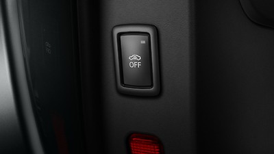 Comfort key with sensor-controlled luggage compartment release including anti-theft alarm system
